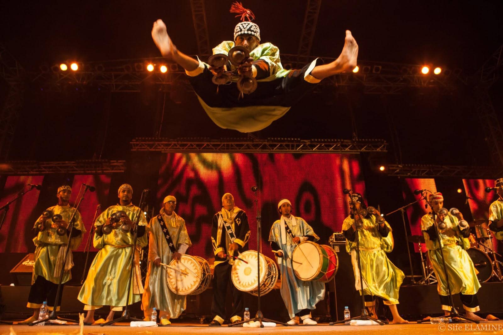 Experience the vibrant energy of the Gnaoua Music Festival, where rhythmic beats and captivating performances celebrate Morocco's rich musical heritage.