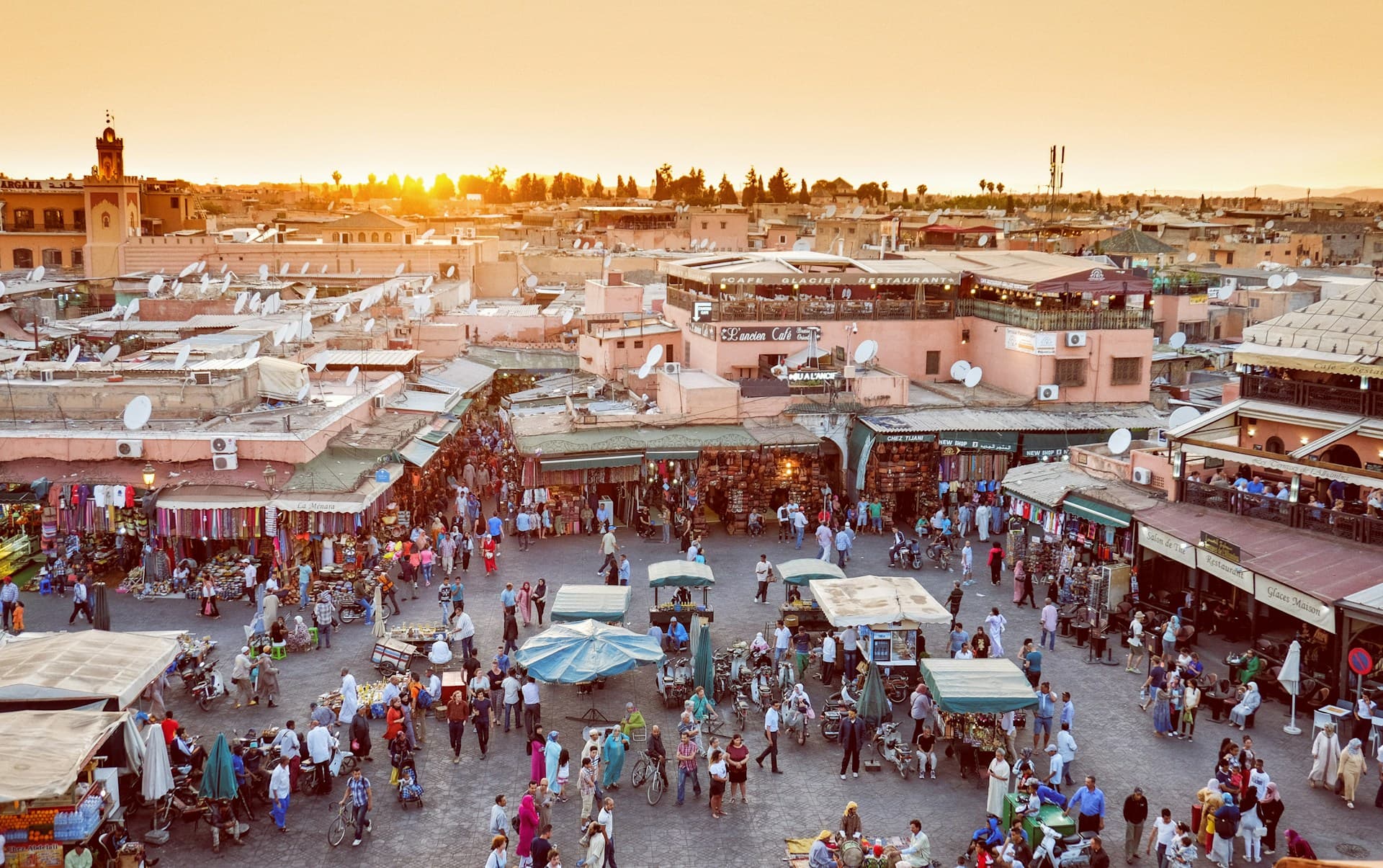 Sunset over the vibrant heart of Marrakesh at Jemaa el-Fnaa, a vibrant hub of culture and commerce