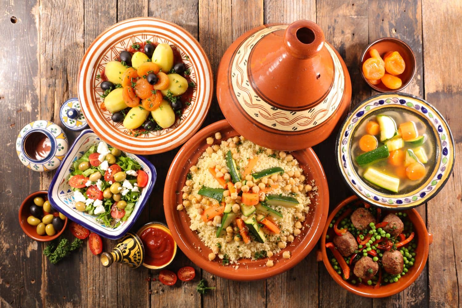 A selection of traditional Moroccan dishes including couscous and tagine.