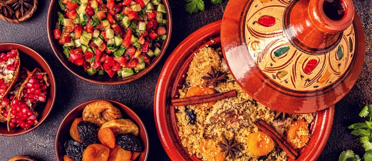 A selection of traditional Moroccan dishes including couscous and tagine.