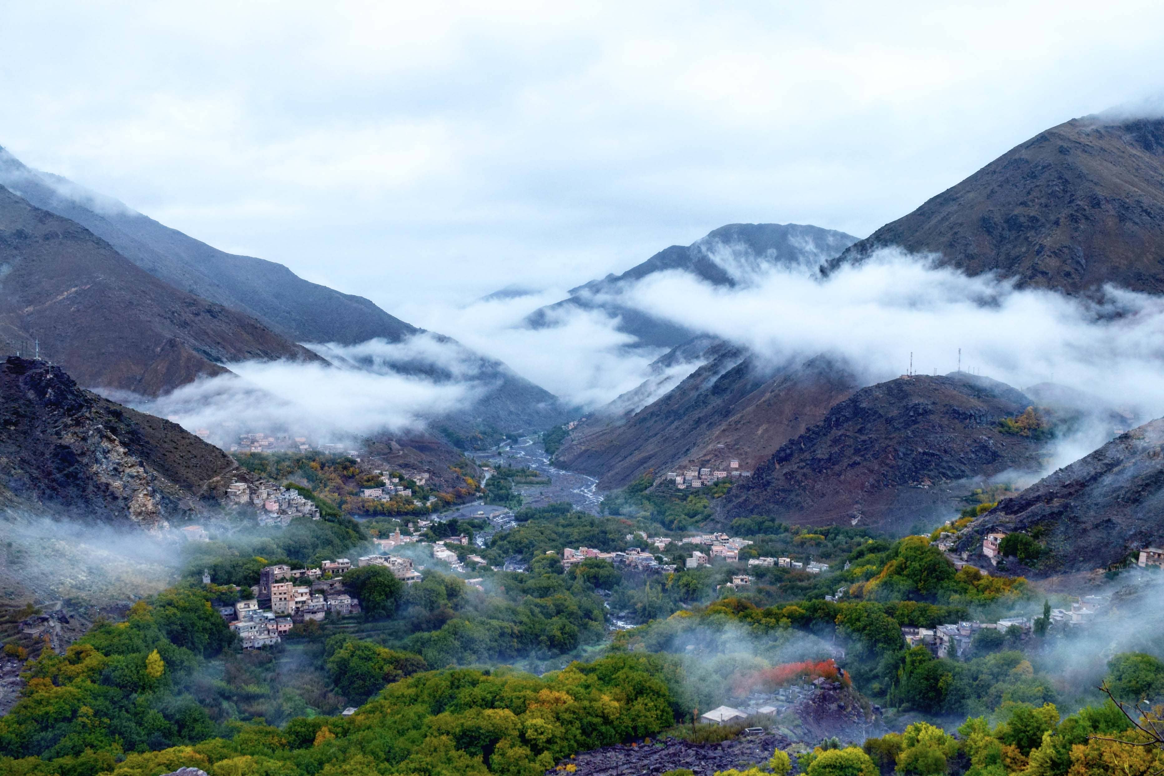 Immerse yourself in the breathtaking beauty of the Atlas Mountains, where picturesque villages nestle amidst towering peaks and mist-covered valleys.